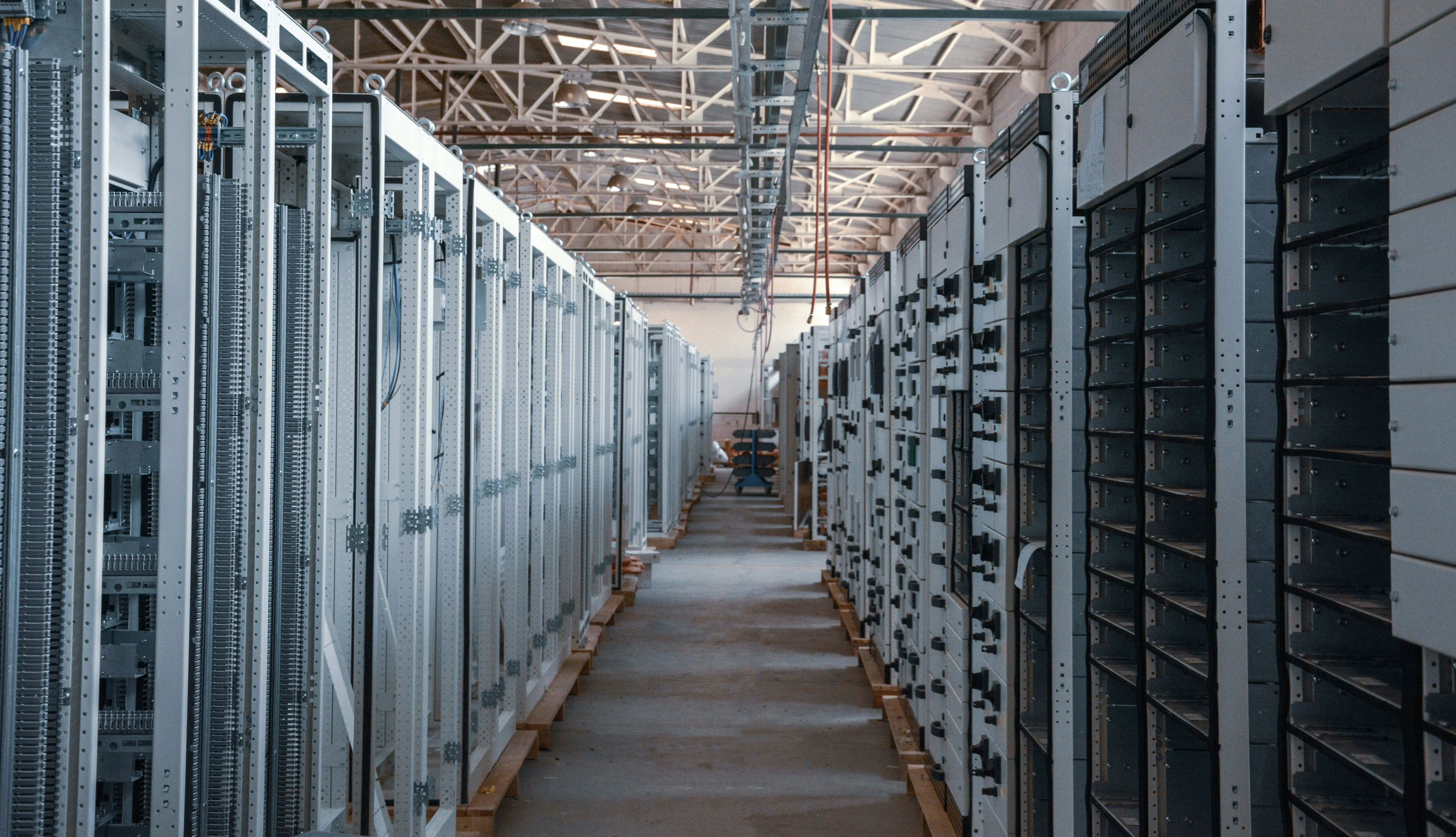 Rows of battery equipment inside an energy storage facility